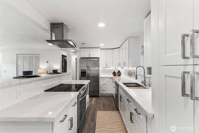 kitchen featuring recessed lighting, exhaust hood, decorative backsplash, appliances with stainless steel finishes, and white cabinets