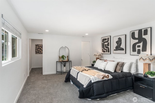 carpeted bedroom featuring baseboards and recessed lighting