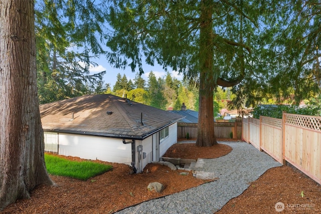 view of property exterior with a fenced backyard