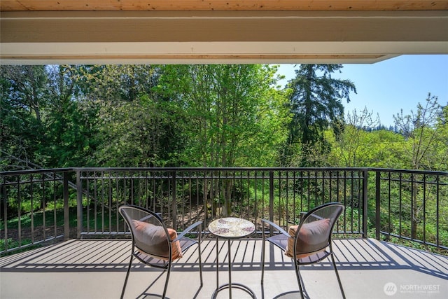 view of patio featuring a balcony
