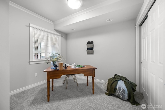 carpeted office space featuring crown molding and baseboards