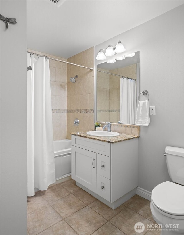 bathroom with tile patterned floors, vanity, toilet, and shower / tub combo with curtain
