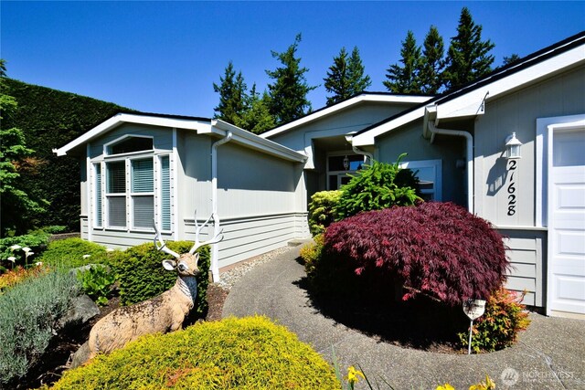 21628 SE 272nd Pl Unit 138, Maple Valley, WA 98038 - view of property exterior featuring an attached garage