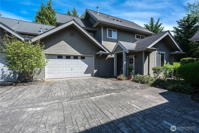view of front of house featuring an attached garage and driveway