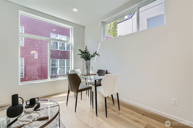 dining area featuring recessed lighting, light wood-style floors, and baseboards
