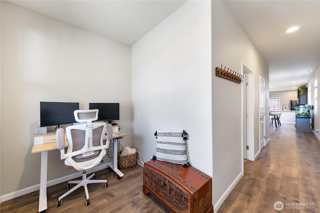 office featuring wood finished floors and baseboards