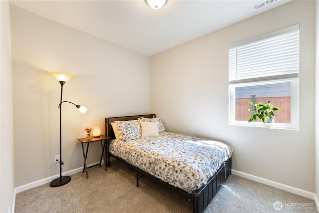 bedroom featuring baseboards, visible vents, and carpet flooring