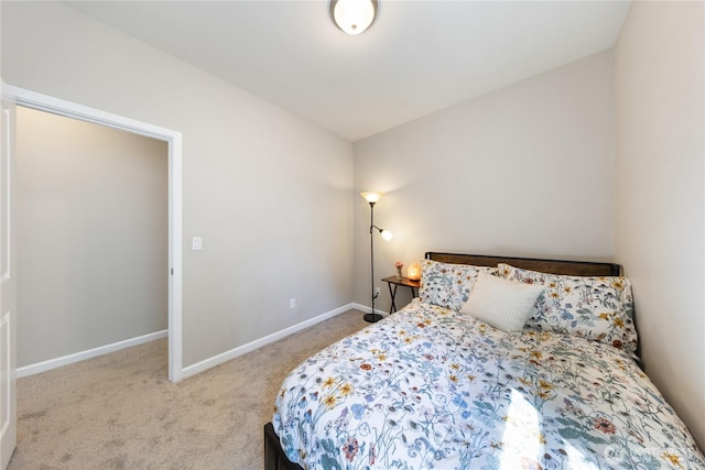 bedroom with baseboards and carpet floors