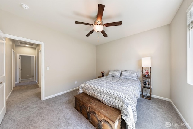 bedroom with baseboards, visible vents, ceiling fan, and carpet flooring