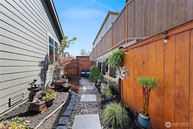 view of yard featuring a fenced backyard