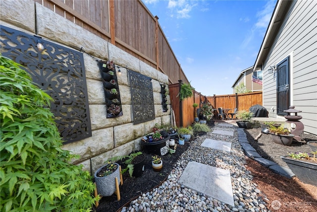 view of yard with a fenced backyard