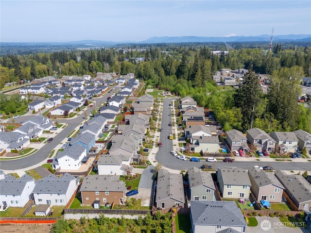 drone / aerial view featuring a mountain view and a residential view