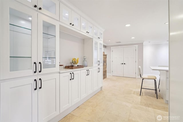 interior space featuring recessed lighting and ornamental molding