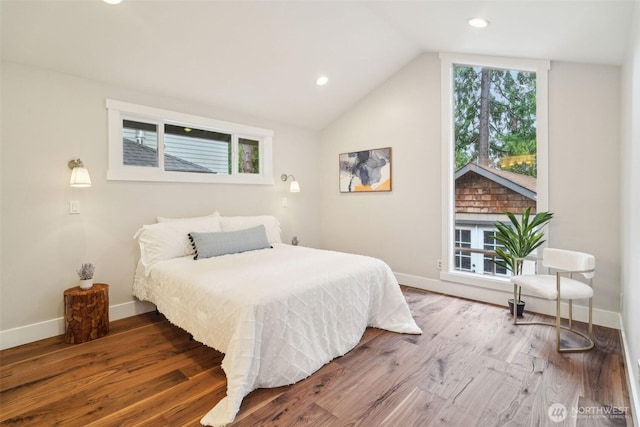 bedroom with lofted ceiling, wood finished floors, recessed lighting, and baseboards