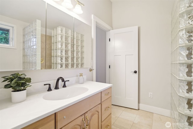bathroom with tile patterned flooring and vanity