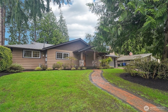 single story home featuring a front yard and covered porch