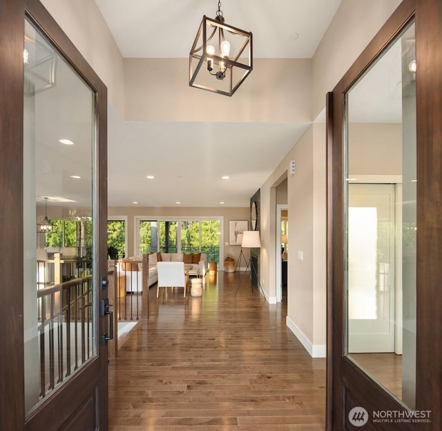 12009 SE 81st Ln, Newcastle, WA 98056 - hallway with recessed lighting, a notable chandelier, wood finished floors, and baseboards