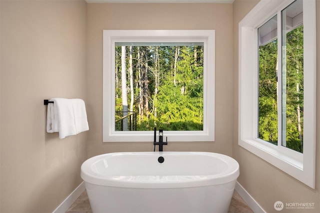 12009 SE 81st Ln, Newcastle, WA 98056 - full bath featuring baseboards and a freestanding bath