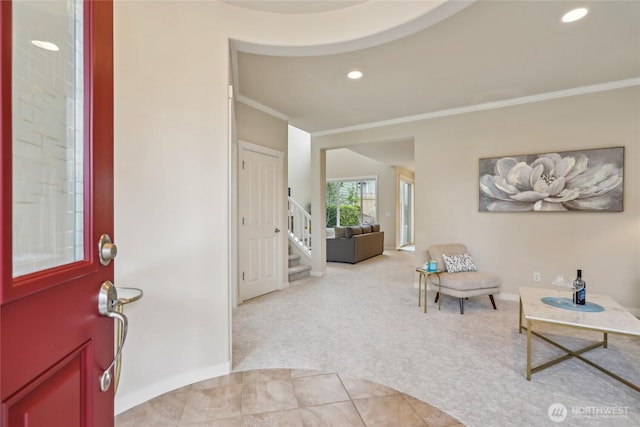 entrance foyer featuring stairway, baseboards, ornamental molding, light carpet, and recessed lighting