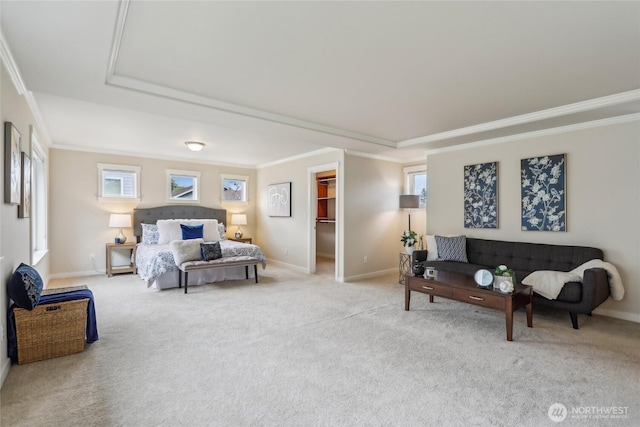 bedroom with baseboards, ornamental molding, and a tray ceiling