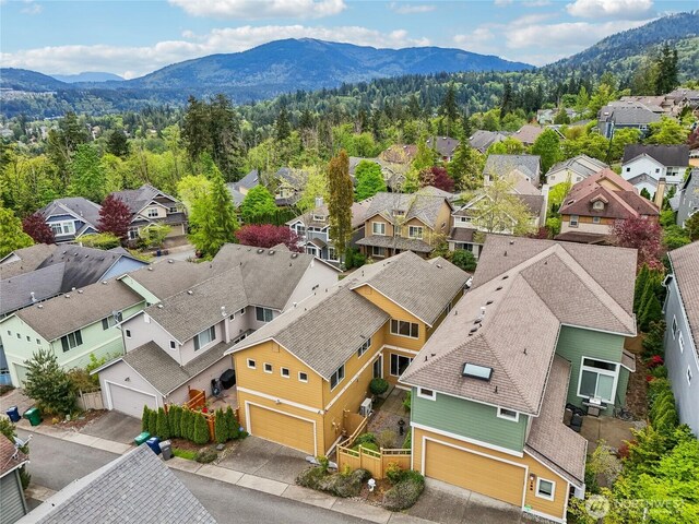 birds eye view of property featuring a mountain view and a residential view