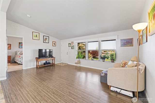 103 Secluded Way, Sequim, WA 98382 - living room featuring visible vents, wood finished floors, lofted ceiling, and baseboards