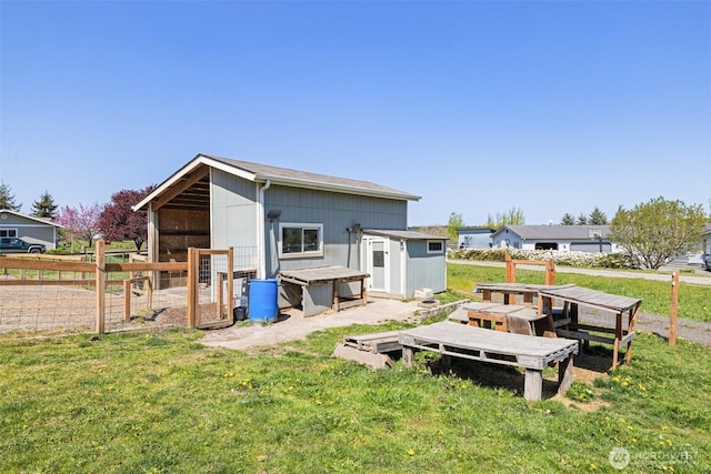 103 Secluded Way, Sequim, WA 98382 - rear view of property featuring a lawn and an outdoor structure