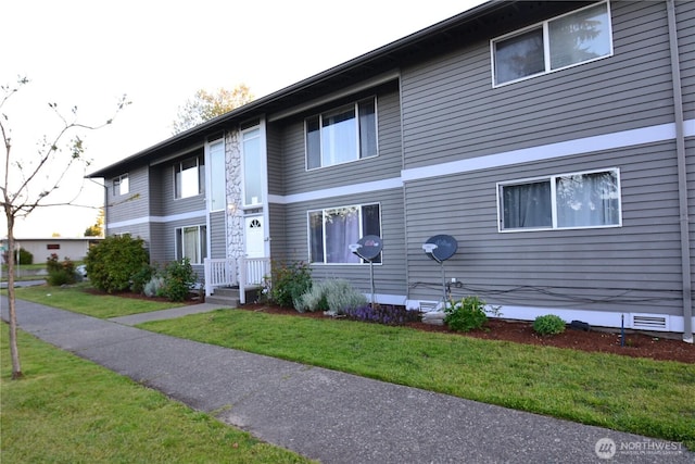 exterior space with a front lawn