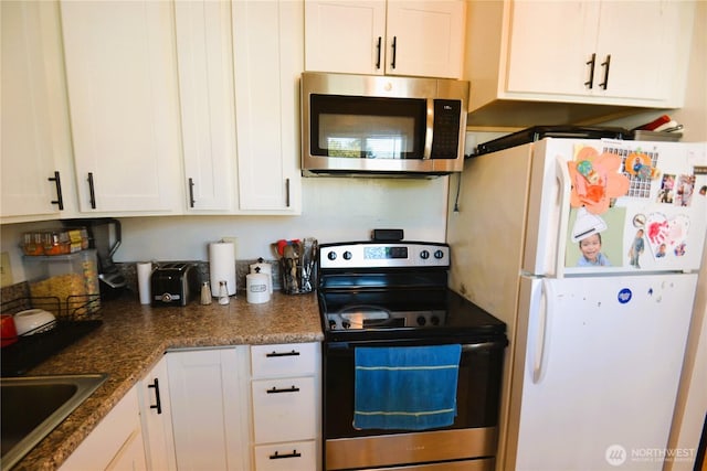 kitchen featuring white cabinetry, appliances with stainless steel finishes, and a sink