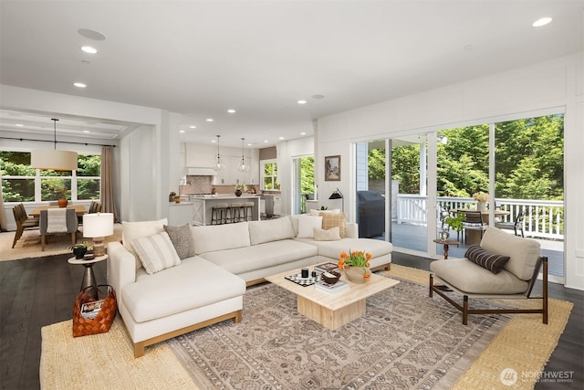 living room featuring recessed lighting and dark wood-style floors