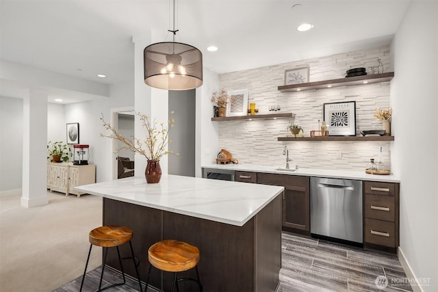 bar featuring decorative backsplash, recessed lighting, a sink, wet bar, and dishwasher