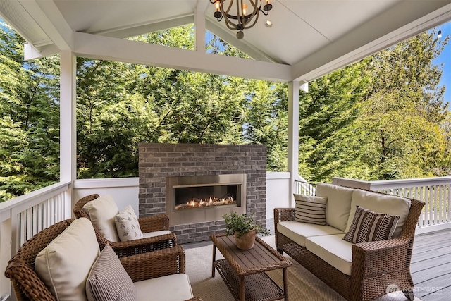 deck featuring an outdoor living space with a fireplace