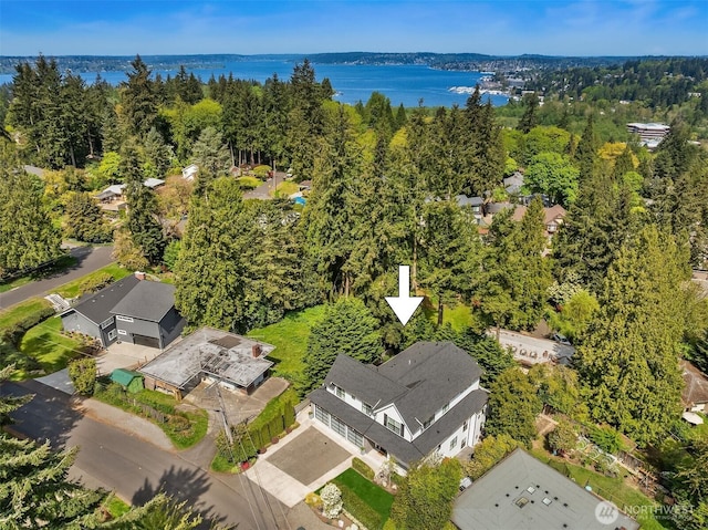 birds eye view of property with a water view