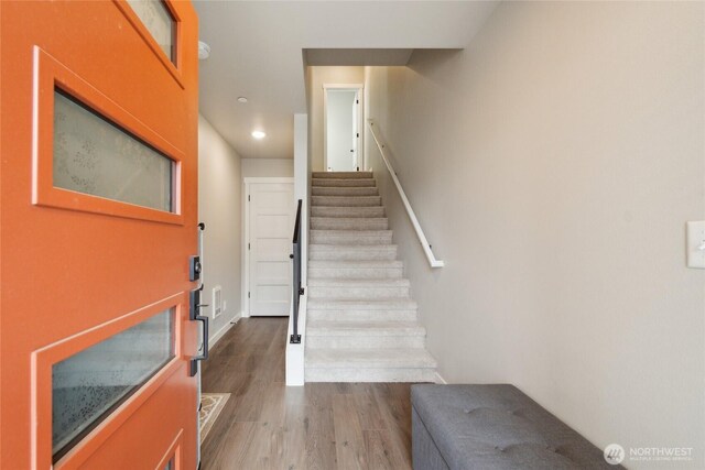 interior space with recessed lighting, baseboards, and wood finished floors