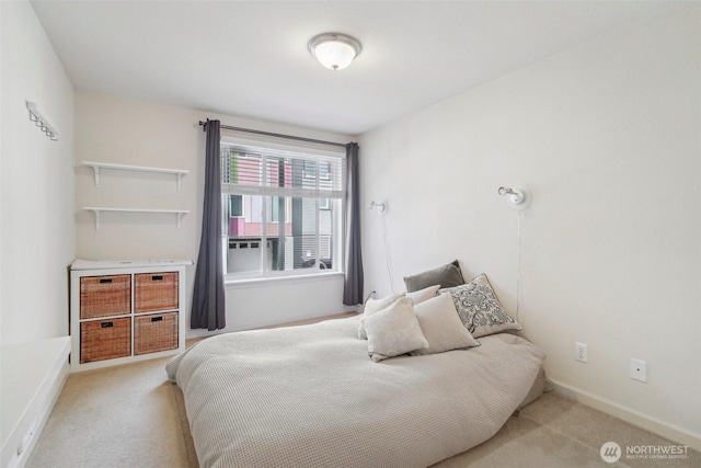 bedroom featuring carpet floors and baseboards