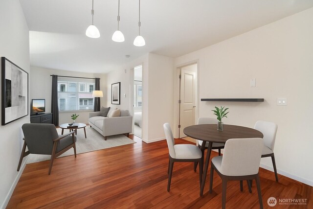 3045 20th Ave W Unit 208, Seattle, WA 98199 - dining area featuring wood finished floors and baseboards