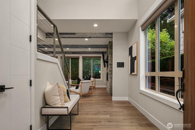 corridor featuring recessed lighting, baseboards, and light wood-style flooring