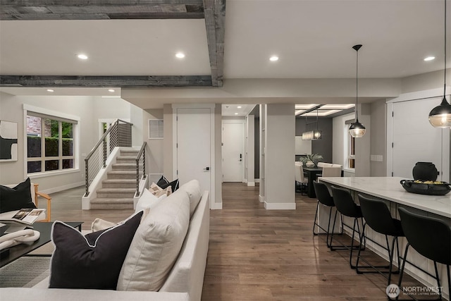 living room featuring baseboards, recessed lighting, and dark wood-style floors