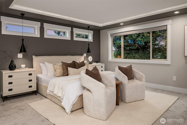 bedroom with recessed lighting, baseboards, light carpet, and a raised ceiling