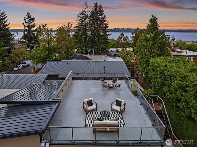 patio terrace at dusk with a water view