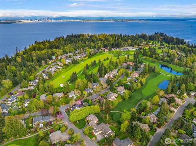 birds eye view of property featuring a water view, golf course view, and a residential view