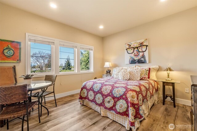 bedroom featuring baseboards, recessed lighting, and light wood-style flooring