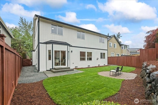 back of house with a patio, a fenced backyard, a gate, entry steps, and a yard