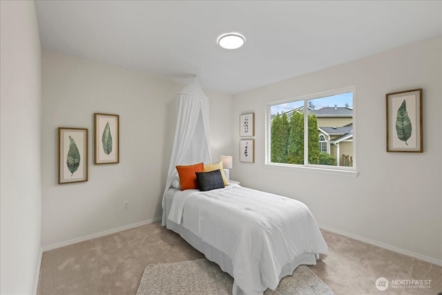 bedroom with carpet flooring and baseboards