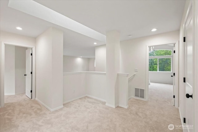 interior space featuring recessed lighting, baseboards, and visible vents