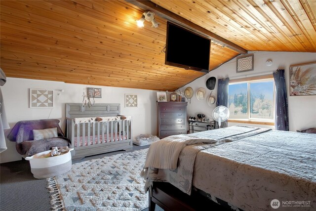 bedroom with lofted ceiling and wood ceiling