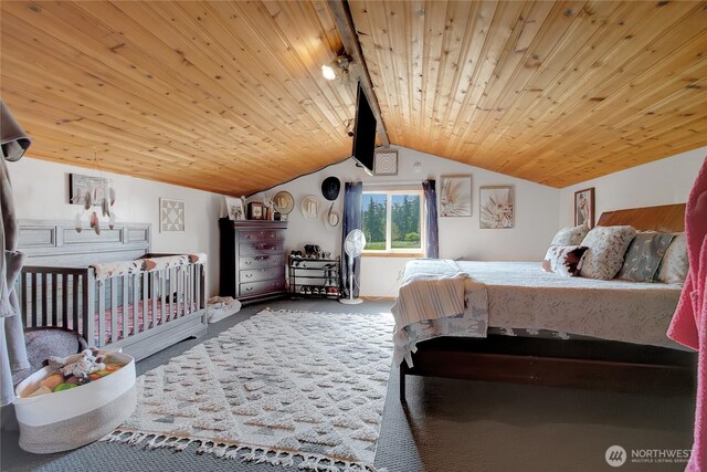 carpeted bedroom featuring rail lighting, vaulted ceiling, and wooden ceiling