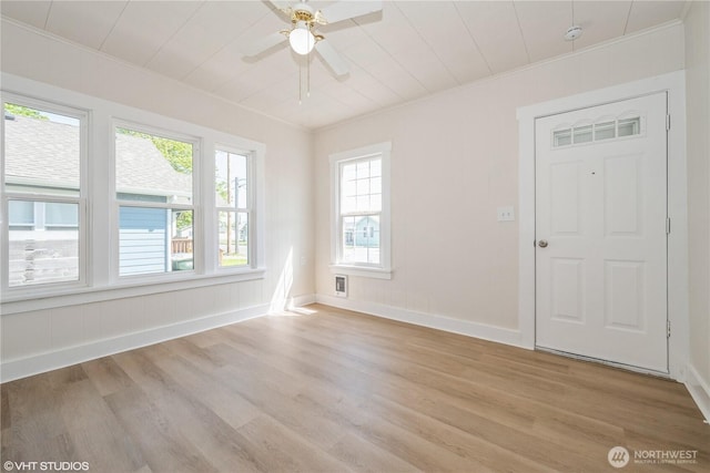 211 Yew St, Centralia, WA 98531 - spare room featuring crown molding, light wood-type flooring, and a ceiling fan