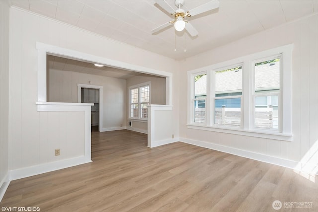 211 Yew St, Centralia, WA 98531 - unfurnished room with crown molding, light wood-style flooring, baseboards, and a ceiling fan