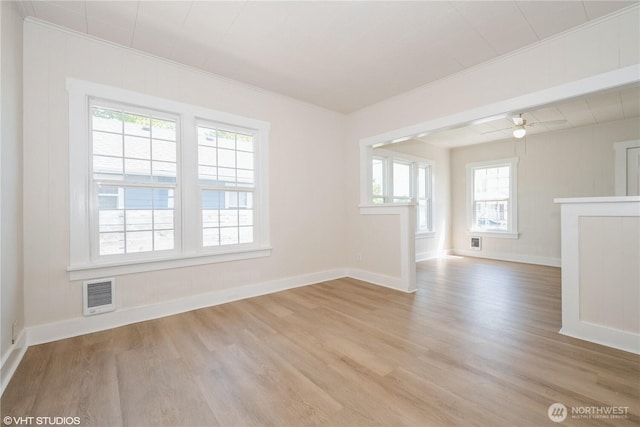 211 Yew St, Centralia, WA 98531 - unfurnished room featuring baseboards, ornamental molding, visible vents, and wood finished floors